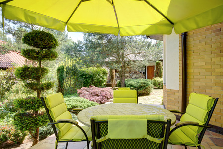 58687184 - relax in the garden under the umbrella